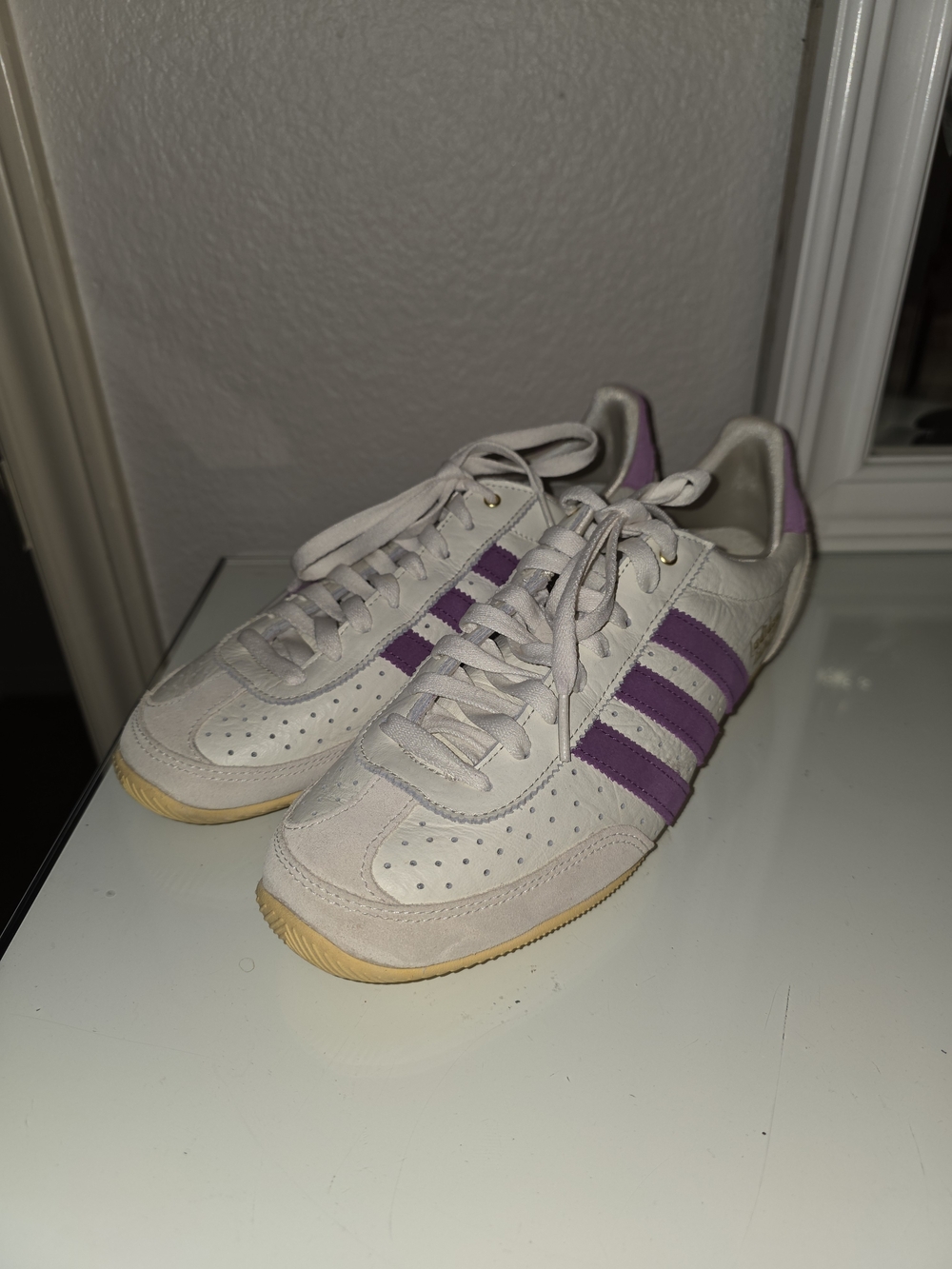 Classic Three-Stripe Adidas Japan Sneakers in Cream with Purple Accents
